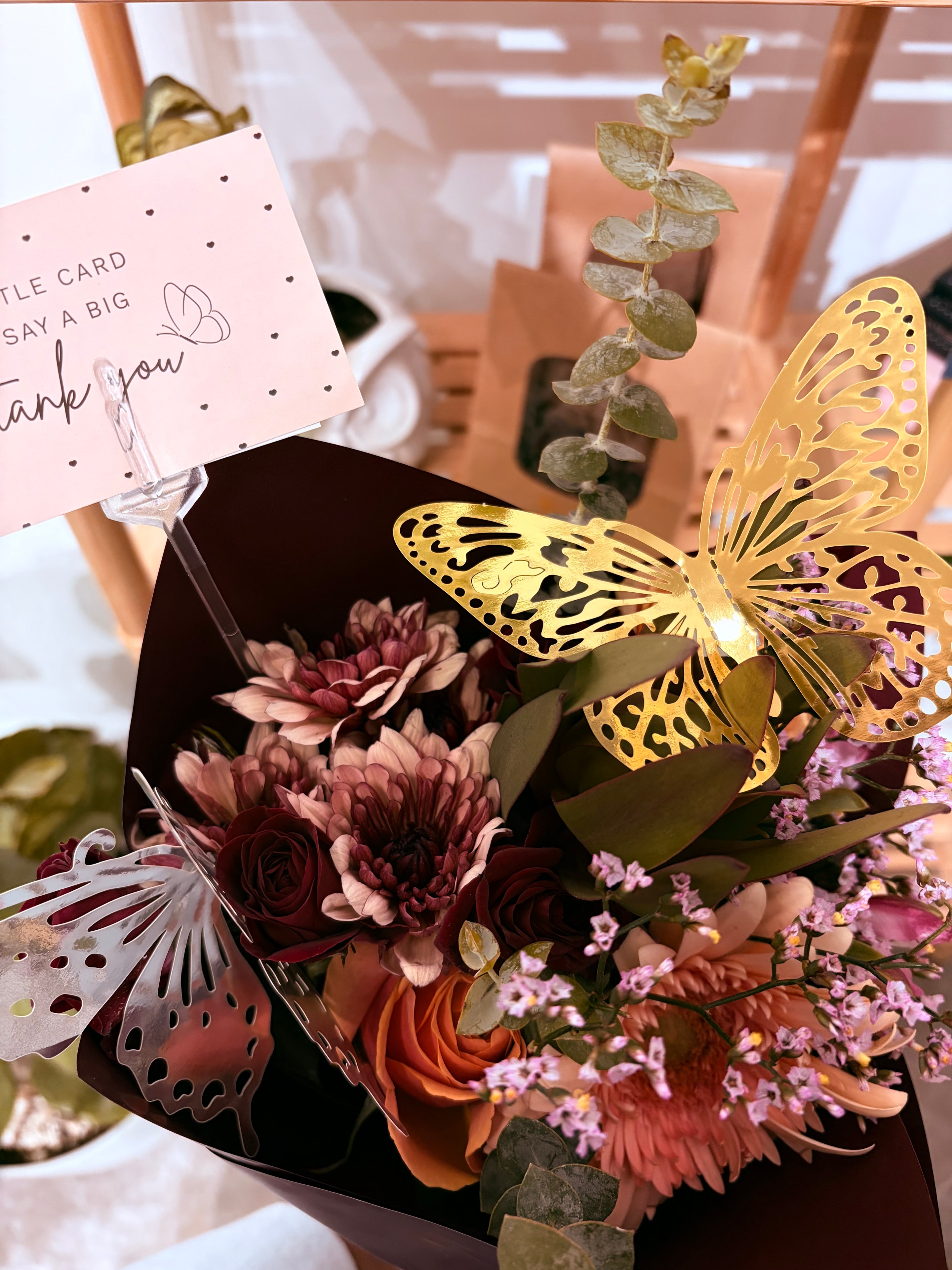 Autumn flower bouquet with thank you card and golden butterfly