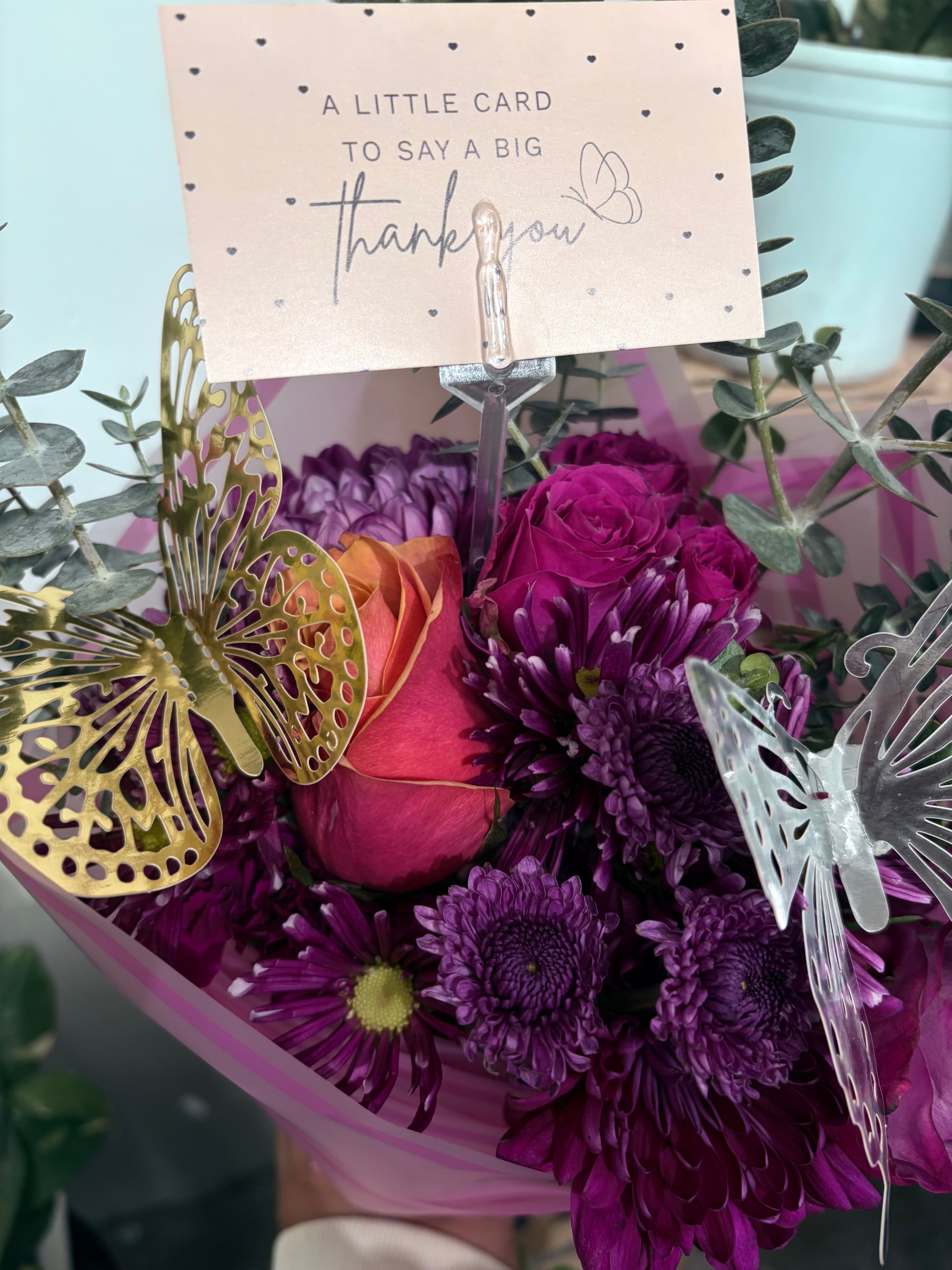 Purple flower bouquet with thank you card